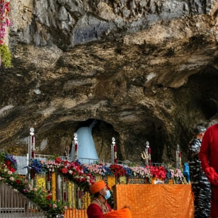 Sacred Ice Shivling inside the Amarnath Cave decorated for darshan during the annual Amarnath Yatra in Jammu and Kashmir, India.