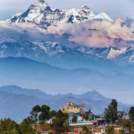Garhwal Himalayan mountain ranges rising above a hill town in Uttarakhand