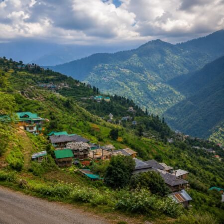 Scenic Green Valley viewpoint between Shimla and Kufri with lush hills, mountain villages and panoramic Himalayan views, featured in the Shimla Tour Package from Delhi.