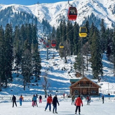 Gulmarg Gondola cable car ride over snow-capped mountains, part of the Srinagar tour package from Delhi