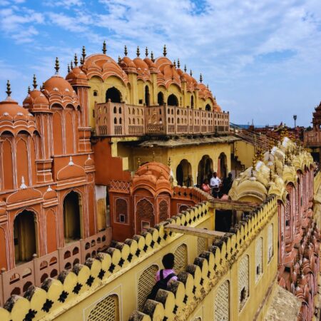 Interior corridor view of Hawa Mahal in Jaipur, Rajasthan, showcasing its historic pink sandstone architecture and intricate Rajput design.