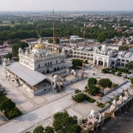 Drone aerial view of Takht Sri Keshgarh Sahib in Anandpur Sahib, Punjab, showcasing the complete Gurudwara complex, marble courtyard, Nishan Sahib, and surrounding landscape.