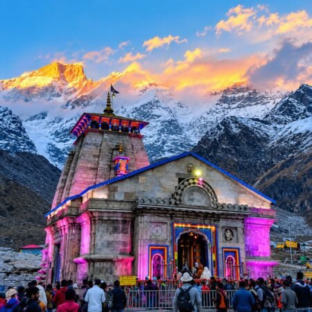 Kedarnath Temple surrounded by snow-covered Himalayan mountains during Kedarnath Yatra