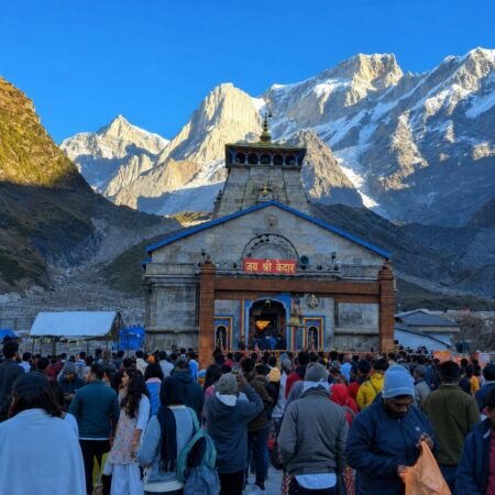 Kedarnath Temple surrounded by snow-capped Himalayan peaks during the Kedarnath pilgrimage