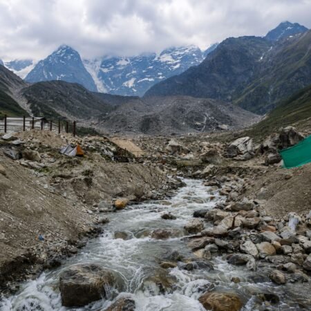 Mandakini River flowing through the rocky Kedarnath valley with snow-covered Himalayan peaks